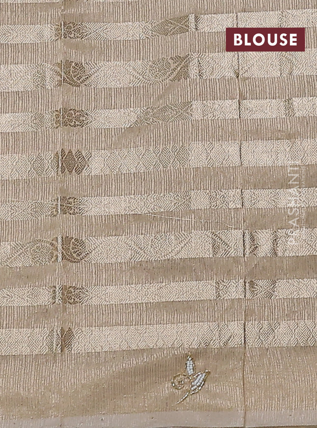 Kota tissue saree beige with allover zari weaves and embroidery butta border