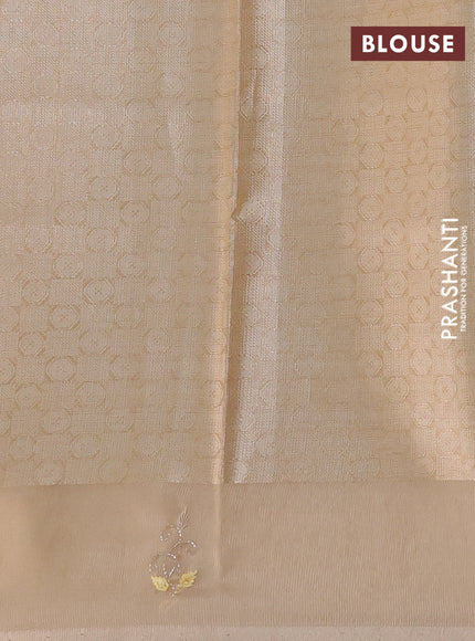 Kota tissue saree sandal with zari woven floral buttas and embroidery butta border