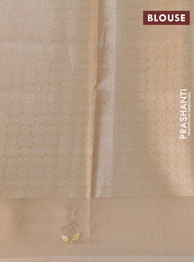 Kota tissue saree sandal with zari woven floral buttas and embroidery butta border