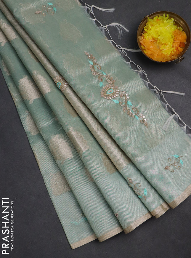 Kota tissue saree teal green with zari woven floral buttas and embroidery butta border