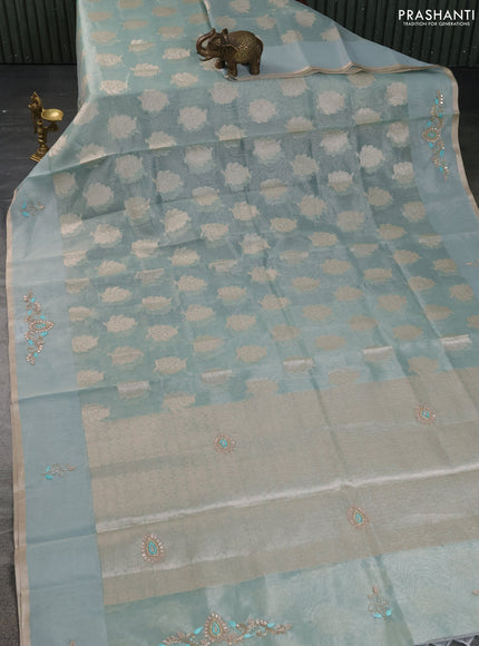 Kota tissue saree teal green with zari woven floral buttas and embroidery butta border