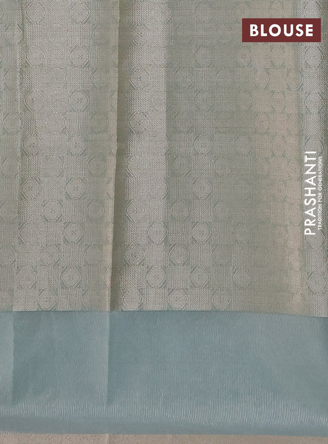 Kota tissue saree teal green with zari woven floral buttas and embroidery butta border