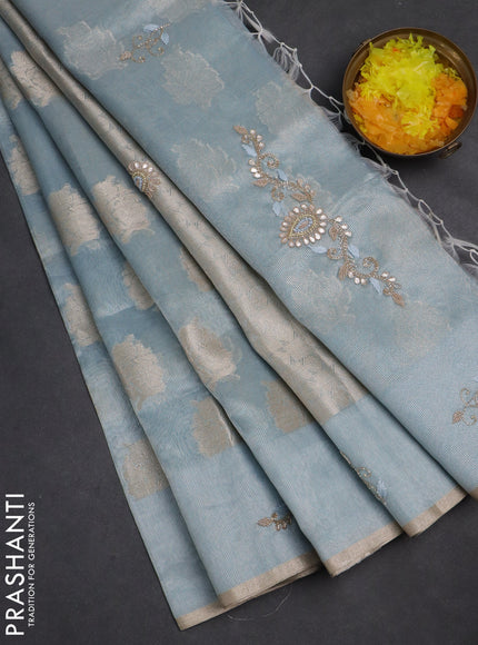 Kota tissue saree light blue with zari woven floral buttas and embroidery butta border