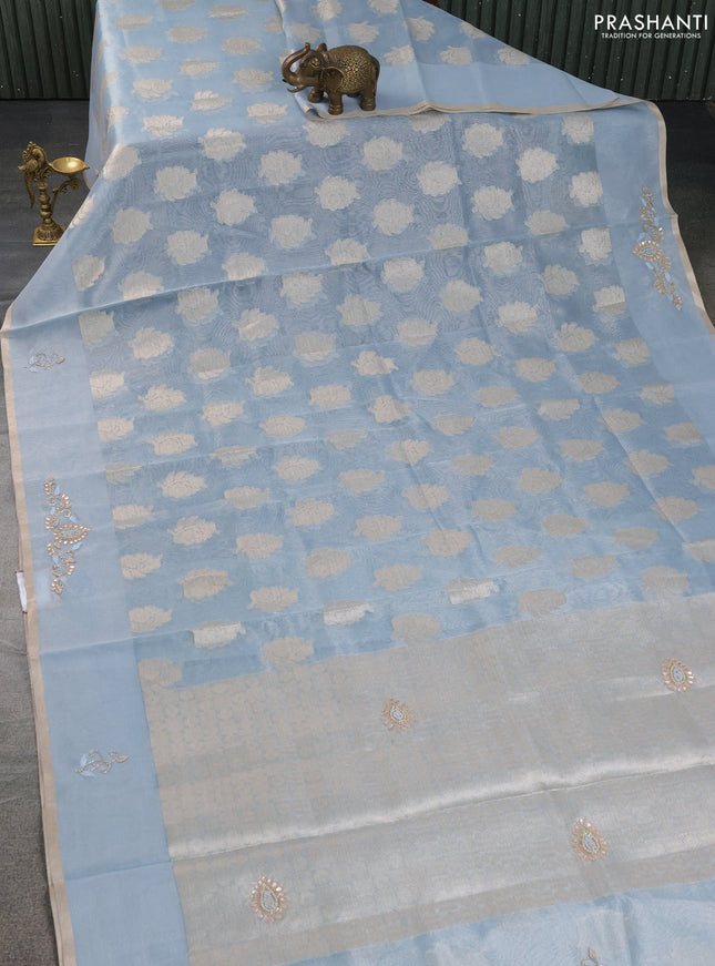 Kota tissue saree light blue with zari woven floral buttas and embroidery butta border