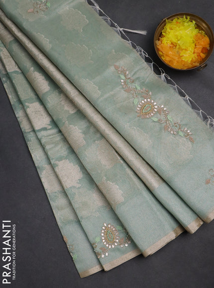 Kota tissue saree teal green shade with zari woven floral buttas and embroidery butta border