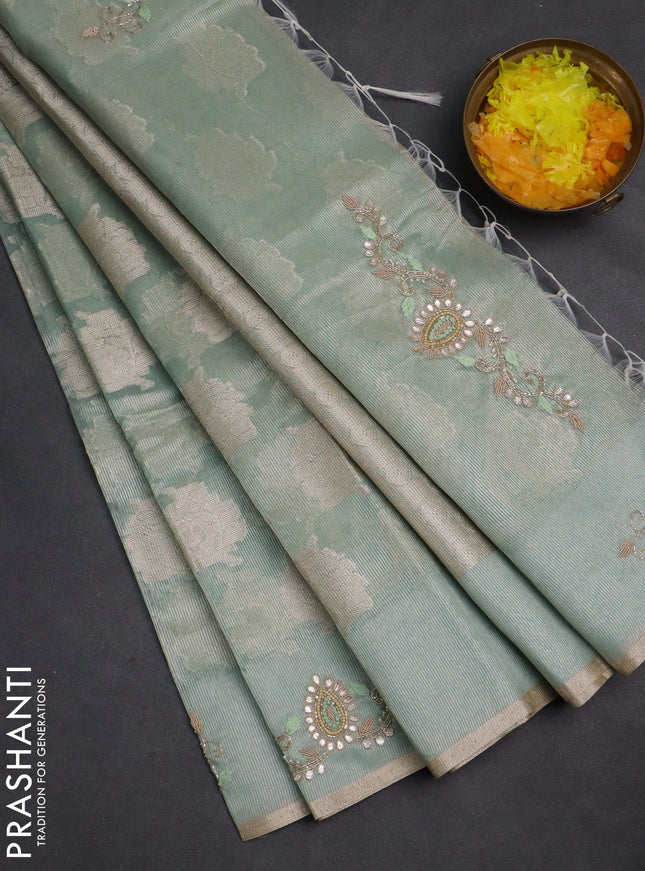 Kota tissue saree teal green shade with zari woven floral buttas and embroidery butta border