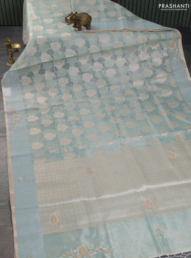 Kota tissue saree teal green shade with zari woven floral buttas and embroidery butta border