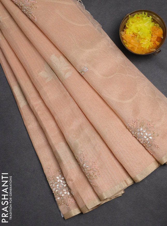 Kota tissue saree peach orange with zari woven floral buttas and embroidery butta border