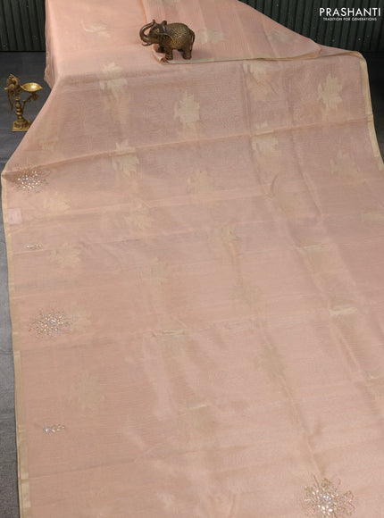 Kota tissue saree peach orange with zari woven floral buttas and embroidery butta border