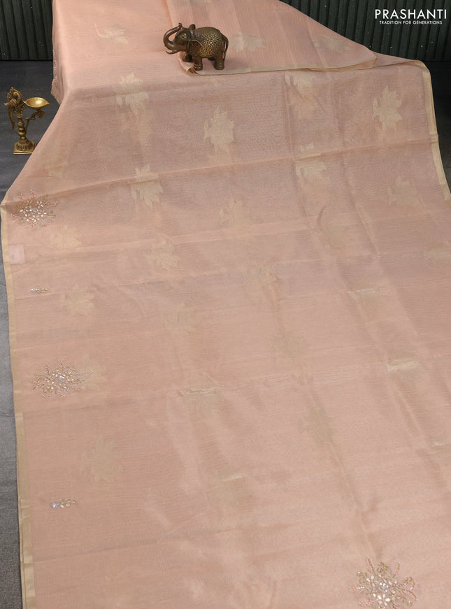 Kota tissue saree peach orange with zari woven floral buttas and embroidery butta border