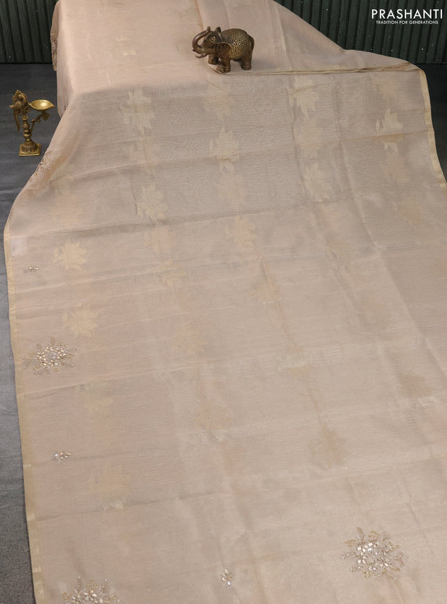 Kota tissue saree beige with zari woven floral buttas and embroidery butta border