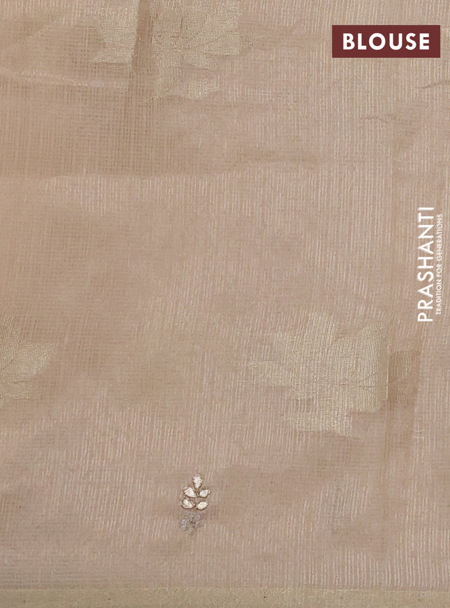 Kota tissue saree beige with zari woven floral buttas and embroidery butta border