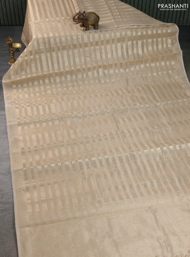 Kota tissue saree beige with allover zari weaves and embroidery butta border