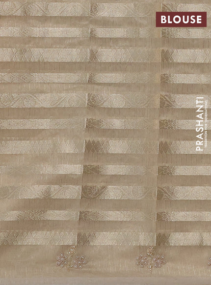 Kota tissue saree beige with allover zari weaves and embroidery butta border