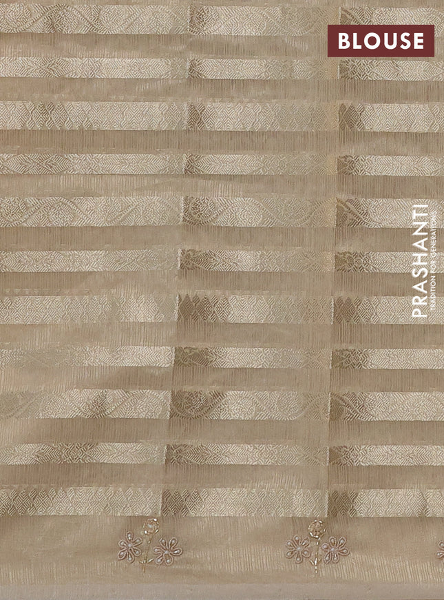 Kota tissue saree beige with allover zari weaves and embroidery butta border