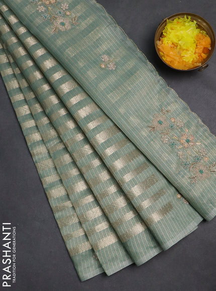 Kota tissue saree teal green with allover zari weaves and embroidery butta border