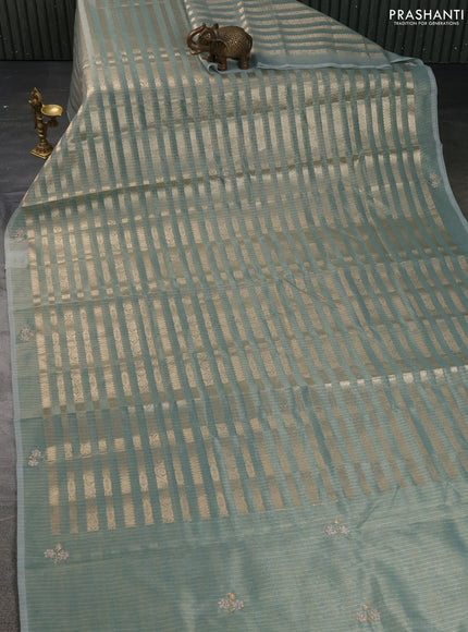 Kota tissue saree teal green with allover zari weaves and embroidery butta border