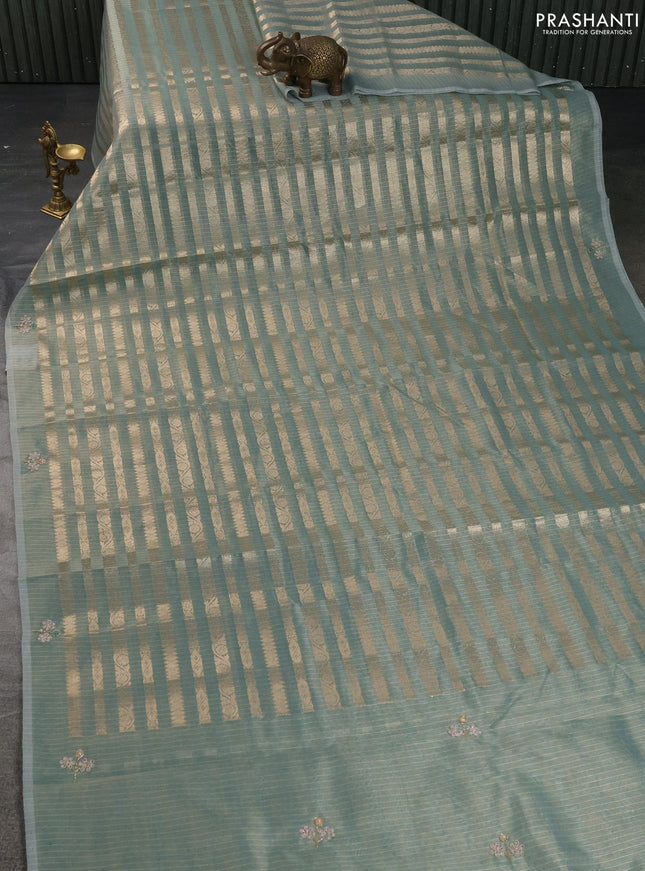 Kota tissue saree teal green with allover zari weaves and embroidery butta border