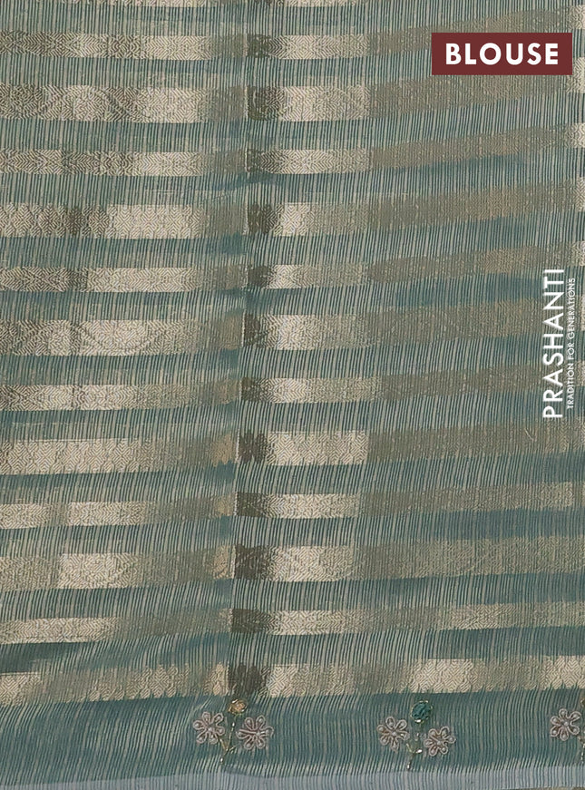 Kota tissue saree teal green with allover zari weaves and embroidery butta border