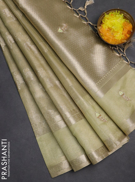 Kota tissue saree pista green with allover zari weaves and zari woven embroidery butta border