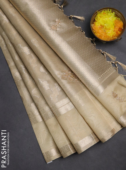 Kota tissue saree sandal with allover zari weaves and zari woven embroidery butta border