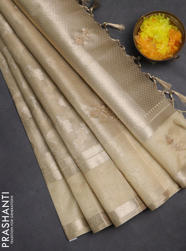 Kota tissue saree sandal with allover zari weaves and zari woven embroidery butta border