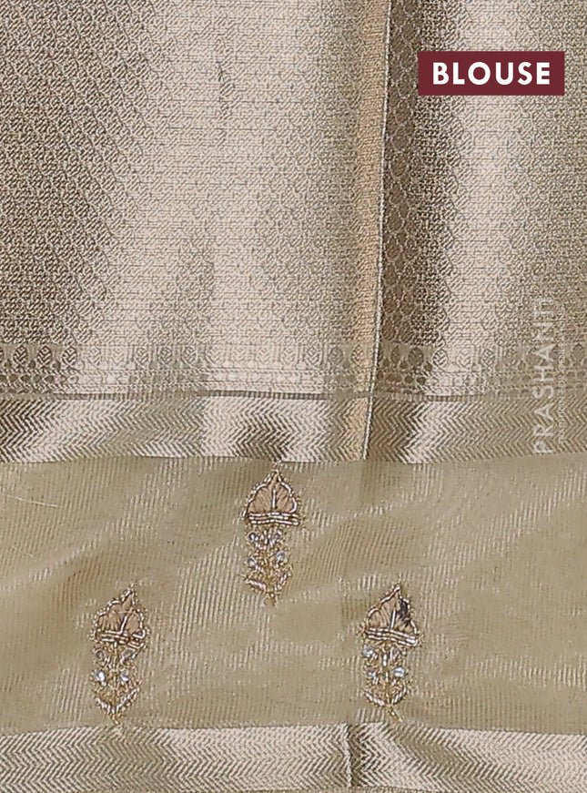 Kota tissue saree sandal with allover zari weaves and zari woven embroidery butta border