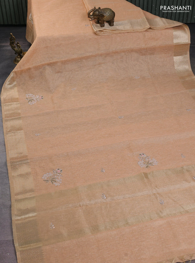 Kota tissue saree pale orange with embroidery buttas and zari woven border