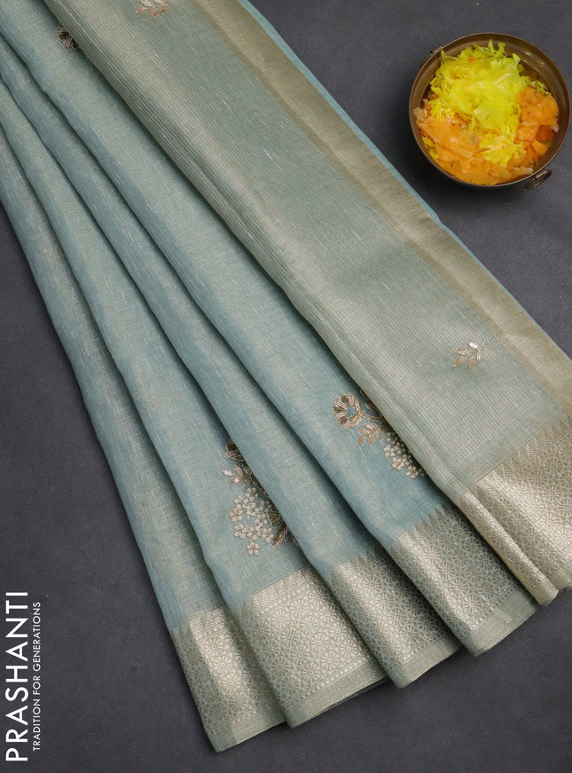 Kota tissue saree teal blue with embroidery buttas and zari woven border
