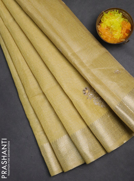 Kota tissue saree sandal with embroidery buttas and zari woven border