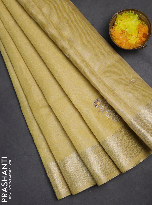 Kota tissue saree sandal with embroidery buttas and zari woven border