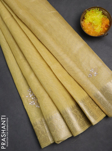 Kota tissue saree sandal with embroidery buttas and zari woven border