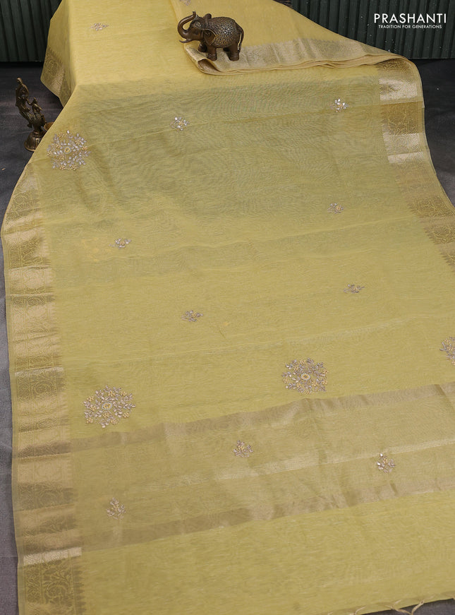 Kota tissue saree sandal with embroidery buttas and zari woven border