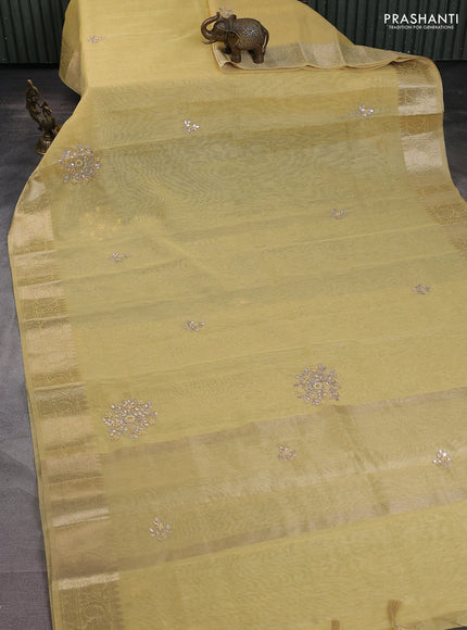 Kota tissue saree peal yellow with embroidery buttas and zari woven border