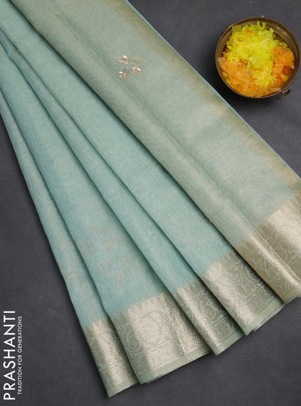Kota tissue saree teal blue with embroidery buttas and zari woven border