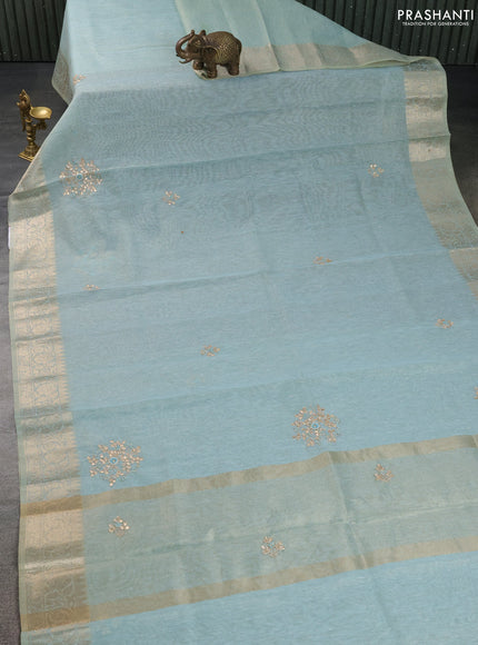 Kota tissue saree teal blue with embroidery buttas and zari woven border