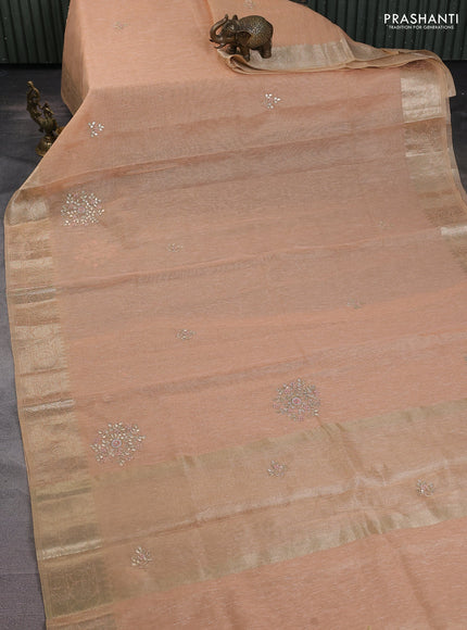Kota tissue saree peach orange with embroidery buttas and zari woven border