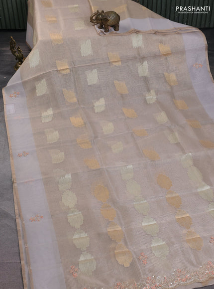 Kota tissue saree beige with zari woven buttas and embroidery butta border