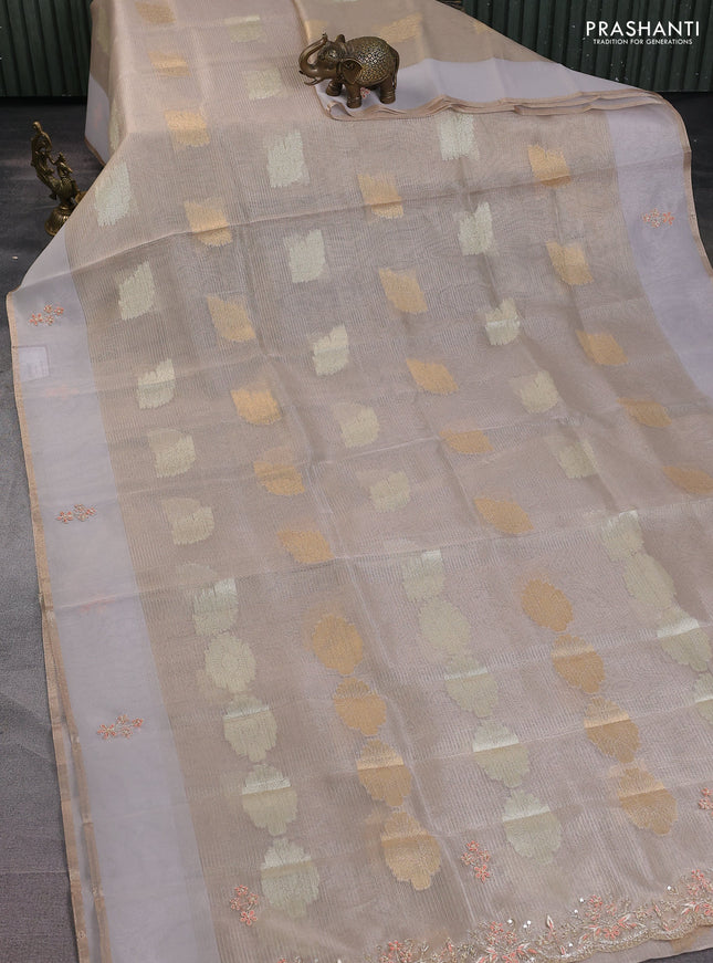 Kota tissue saree beige with zari woven buttas and embroidery butta border