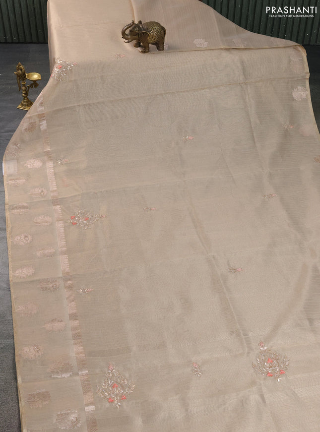 Kota tissue saree beige with embroidery buttas and zari woven floral butta border