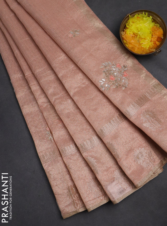 Kota tissue saree peach shade with embroidery buttas and zari woven floral butta border