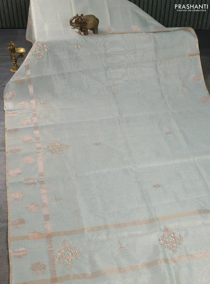 Kota tissue saree pastel green with embroidery buttas and zari woven floral butta border