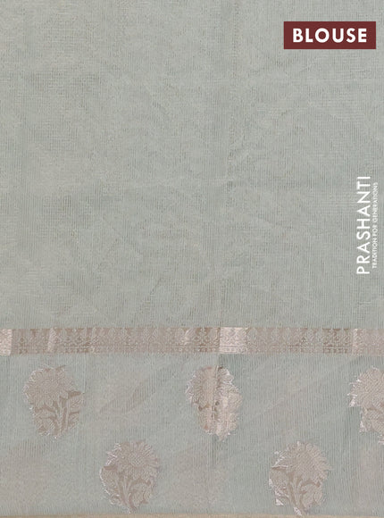 Kota tissue saree pastel green with embroidery buttas and zari woven floral butta border