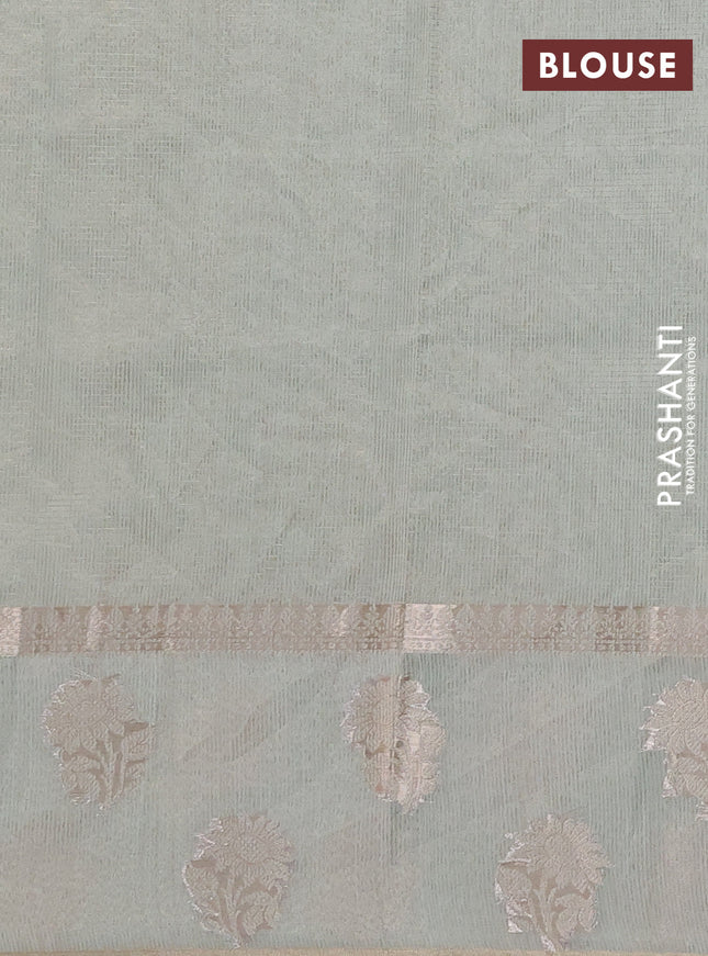 Kota tissue saree pastel green with embroidery buttas and zari woven floral butta border