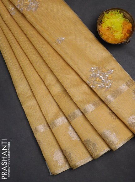 Kota tissue saree yellow with embroidery buttas and zari woven floral butta border