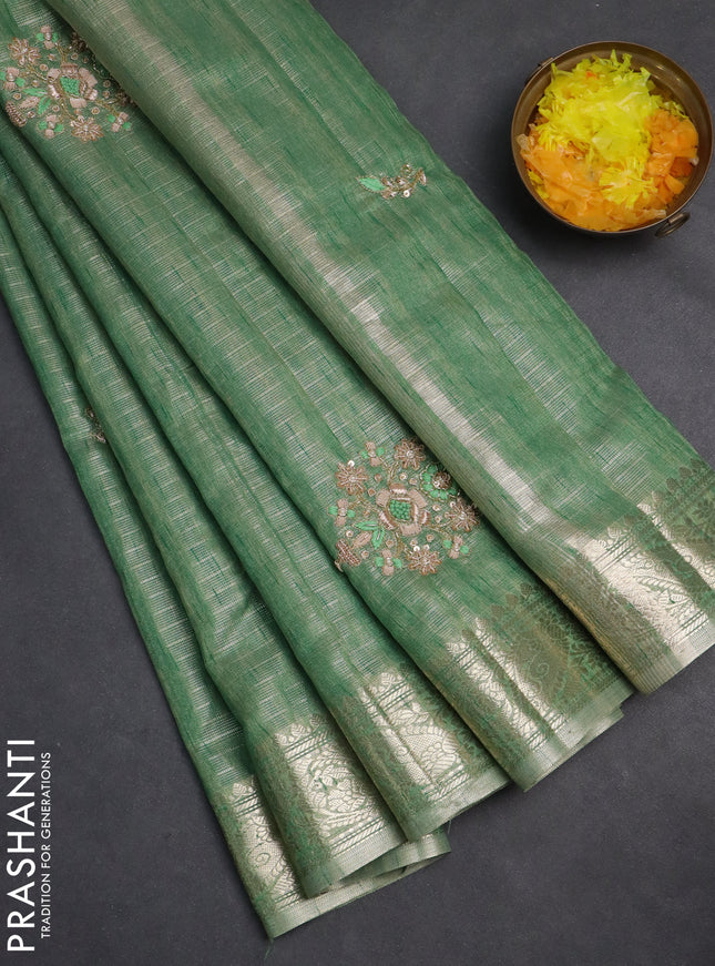Kota tissue saree green shade with embroidery buttas and zari woven border