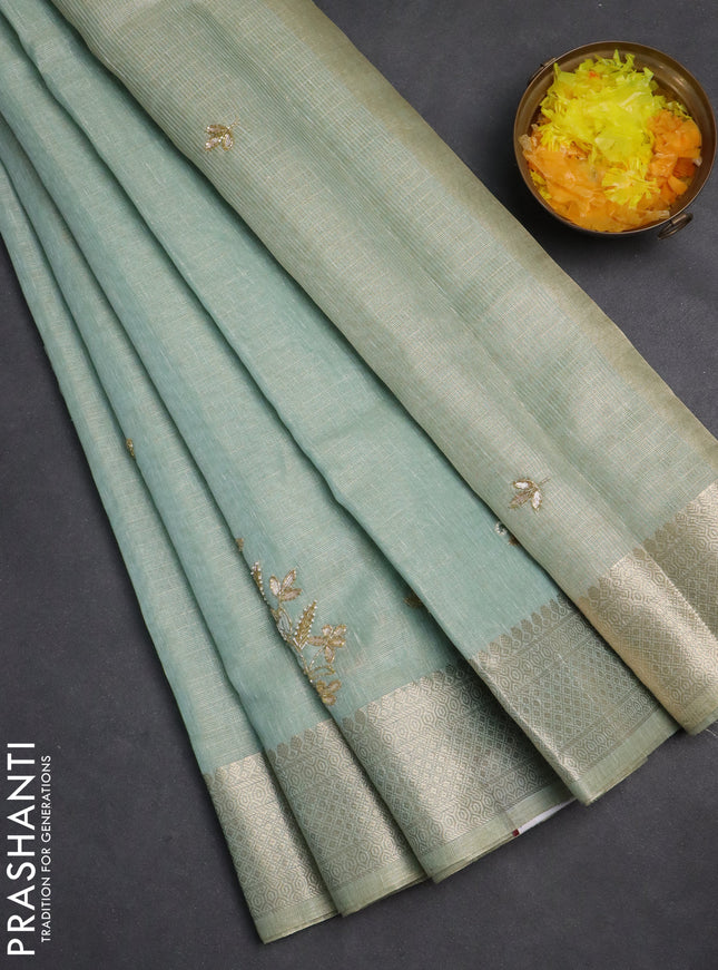 Kota tissue saree teal blue with embroidery buttas and zari woven border