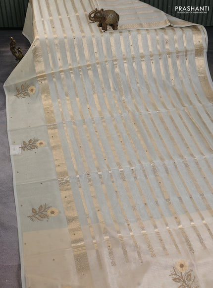 Kota tissue saree beige with allover zari weaves & embroidery buttas and zari woven embroidery butta border