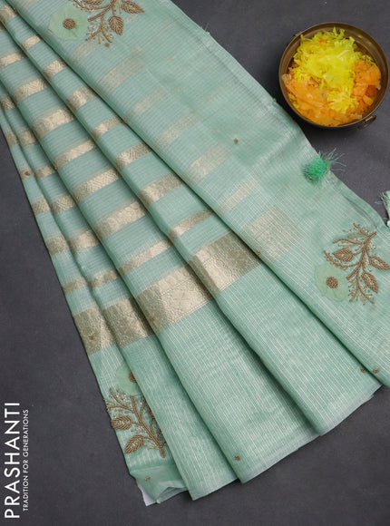 Kota tissue saree teal green with allover zari weaves & embroidery buttas and zari woven embroidery butta border