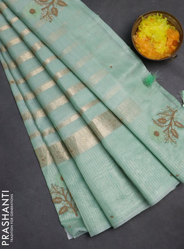 Kota tissue saree teal green with allover zari weaves & embroidery buttas and zari woven embroidery butta border